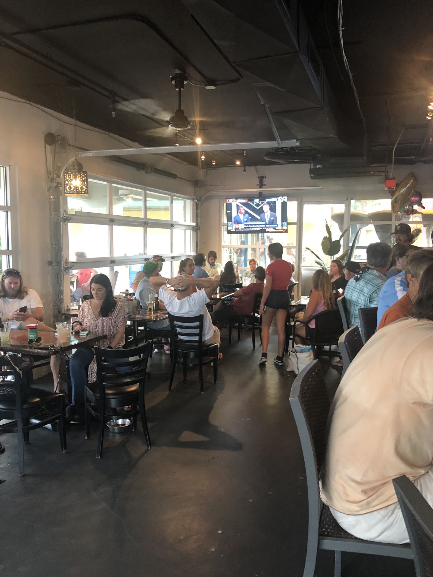 A full dining room on a weekend night